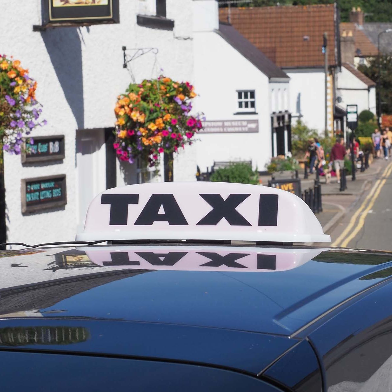 CHEPSTOW, UK - CIRCA SEPTEMBER 2019: taxi sign on a car